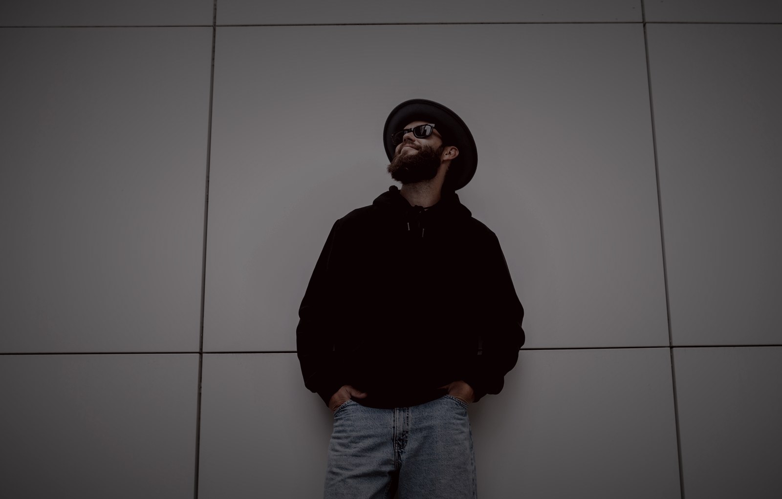 Model in a blackout hoodie, graded cinematic