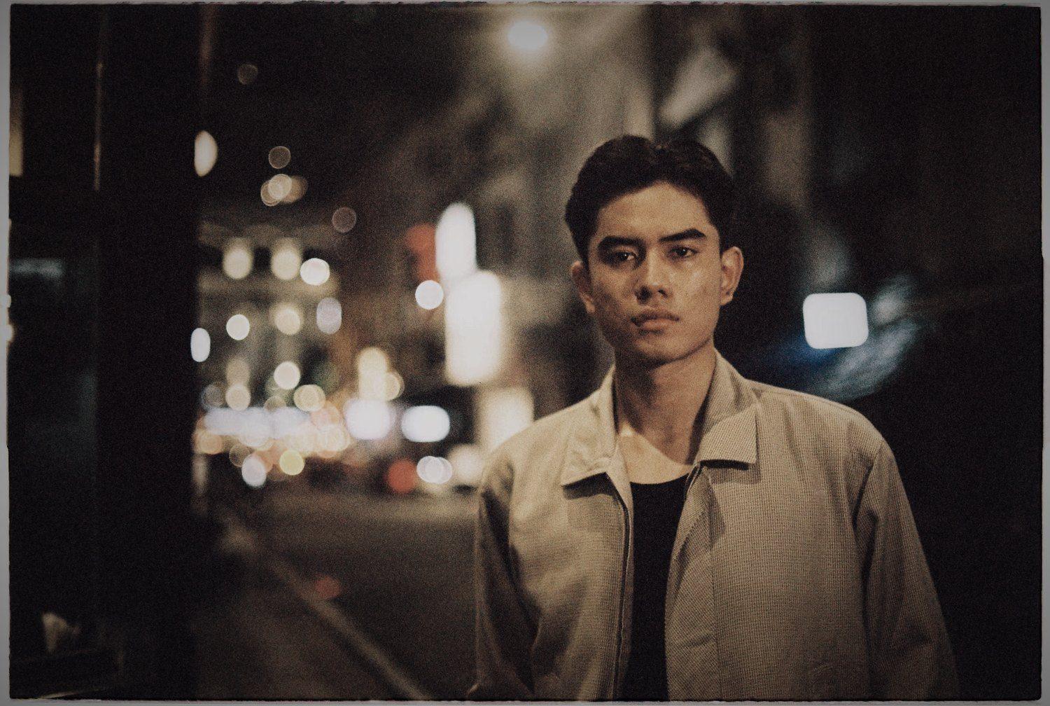 Model in a neon-lit night street
