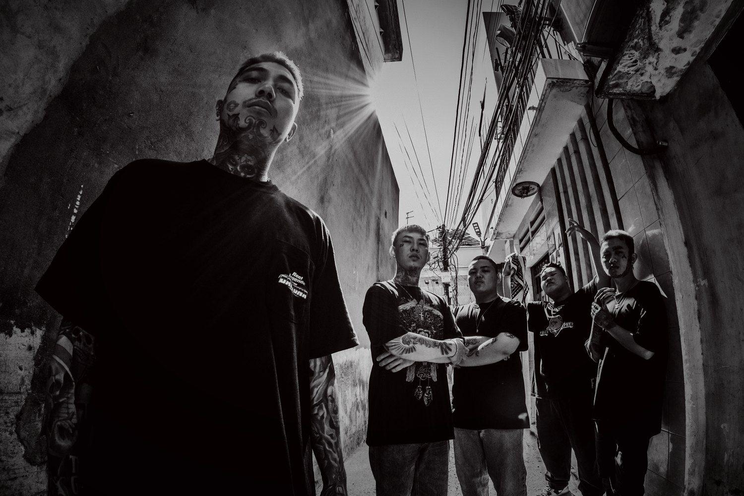 Tattooed crew in an alley